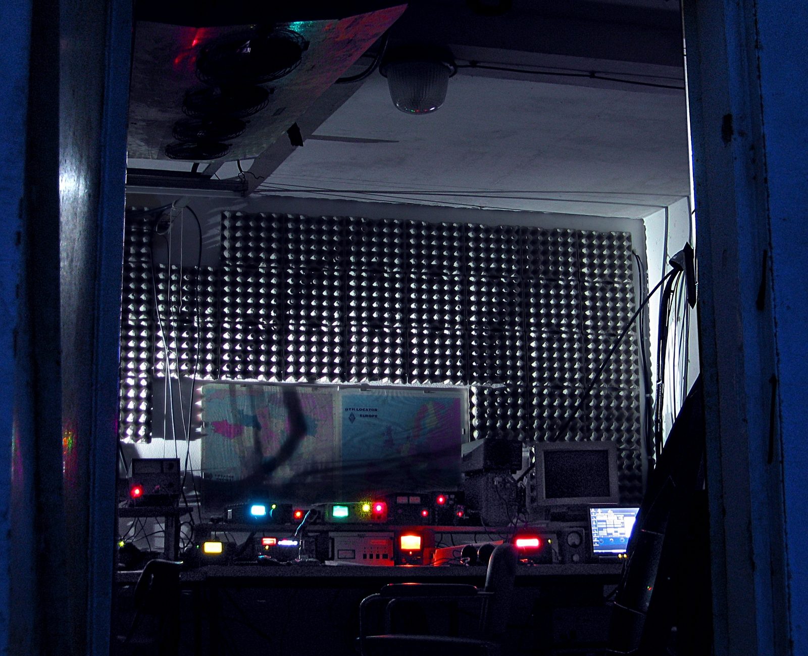 Amateur radio station operating at night, showing illuminated radio equipment