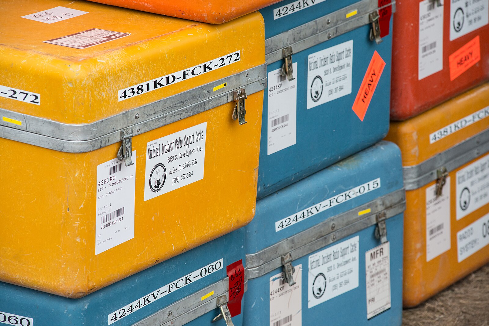 Cases of land mobile radios prepared for deployment to an incident command post